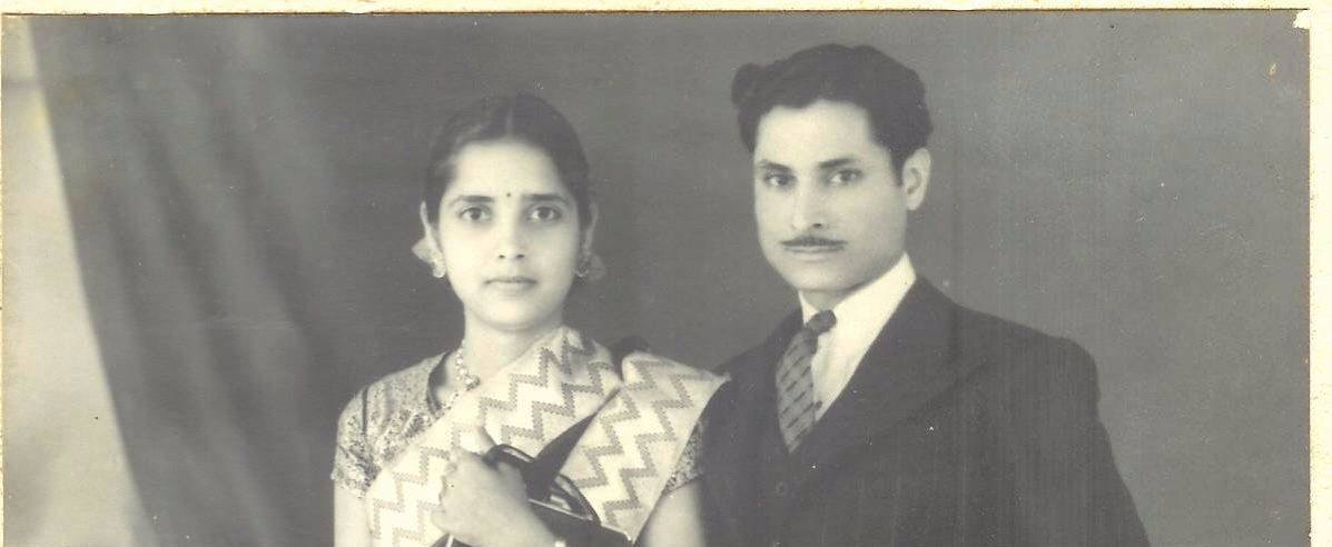 Savitri and Sunderdas Mirchandani, seated for a formal wedding portrait, 20 December 1941